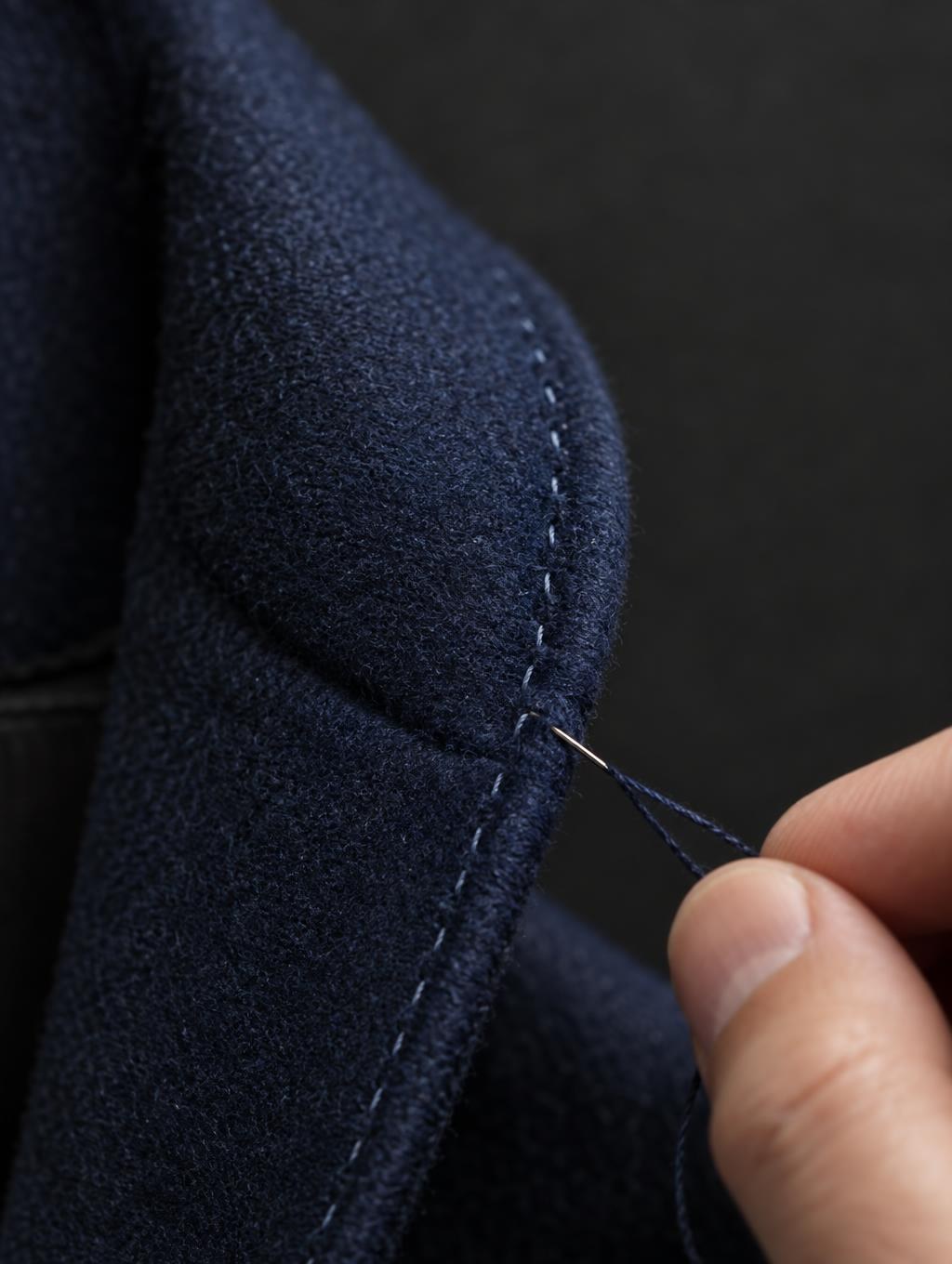 Macro of pick stitching along a lapel edge